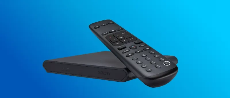 A black DIRECTV receiver box is shown with a matching black remote control resting on top of it, against a blue background.
